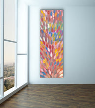 Load image into Gallery viewer, Esther Haywood painting on a wall next to a window with a view of trees.