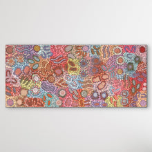 Load image into Gallery viewer, Grandmother's Country Michelle Possum Nungurrayi 178cm x 120cm displayed horizontal on white wall painting is pink, red, purple, brown, blue, with detailed dot work and aboriginal symbols