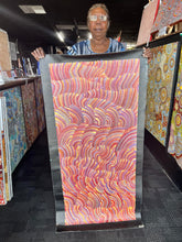 Load image into Gallery viewer, Artist Maureen Nampijinpa Hudson photographed holding her Sand Dunes Tali painting