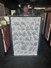 Load image into Gallery viewer, The artist Maureen Nampijinpa Hudson holding her large Sand Dunes (Tali) painting at Art by Farquhar Aboriginal Art Gallery in Adelaide.