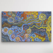 Load image into Gallery viewer, Rich blues and desert gold tones flow across the canvas in Rhoda Tjitayi’s depiction of the sisters’ Dreaming story.