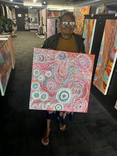 Load image into Gallery viewer, Artist photographed holding her Piltati Tjukurpa painting inside Art by Farquhar Aboriginal Art Gallery, Edwardstown.