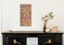Load image into Gallery viewer, Aboriginal painting on a white wall above a black console table with decorative items.