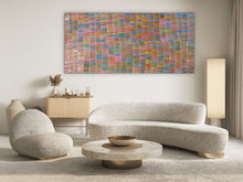 Load image into Gallery viewer, Yam Dreaming painting by Jeannie Mills Pwerle with vibrant rainbow colours displayed in a modern living room 213cm x 104cm