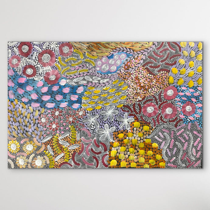 Colorful aboriginal artwork with floral patterns on a white background