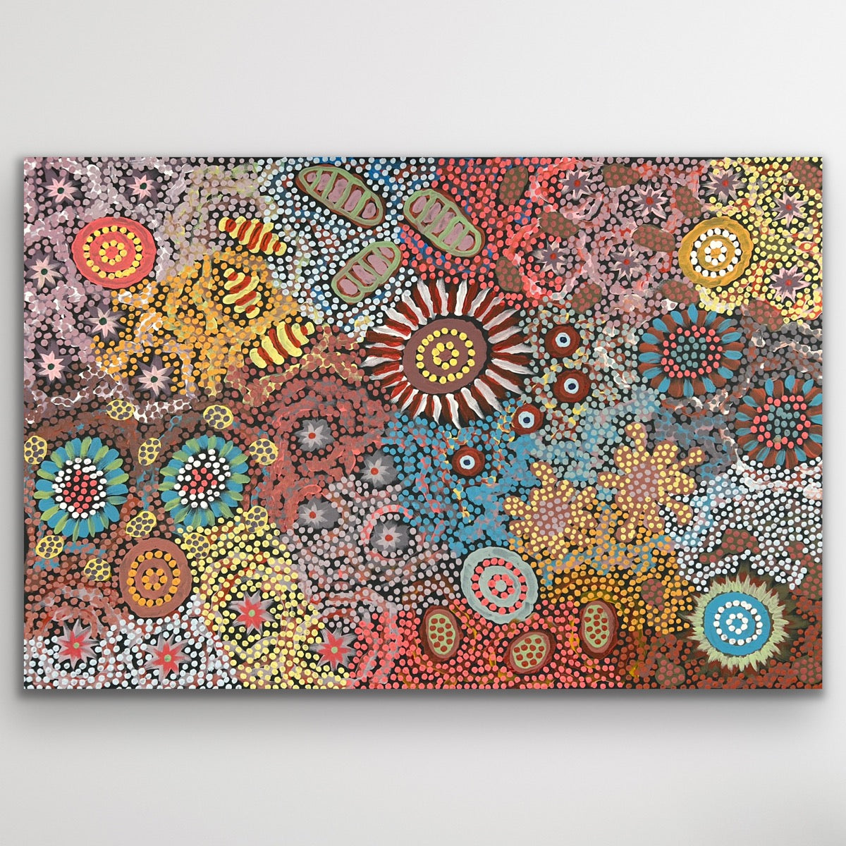 A radiant composition by Michelle Possum Nungurrayi filled with intricate dot work and vibrant desert tones.