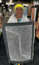 Load image into Gallery viewer, Nancy Martin holding her painting bush onion in gallery
