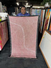 Load image into Gallery viewer, Tansy holding her &quot;Bush Onion&quot; Tansy Martin 142cm x 86cm painting

