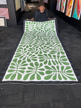 Load image into Gallery viewer, Artist photo Debra McDonald Holding Painting. 
