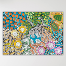 Load image into Gallery viewer, A colorful abstract painting on canvas featuring a variety of patterns, including dots, lines, and floral motifs in green, blue, orange, yellow, pink, and white, displayed against a light gray wall. "Awelye" Karen Bird Ngale 55cm x 40cm
