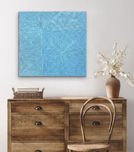 Load image into Gallery viewer, Blue collectable Indigenous painting on a wall above a wooden dresser with a chair and vase.
