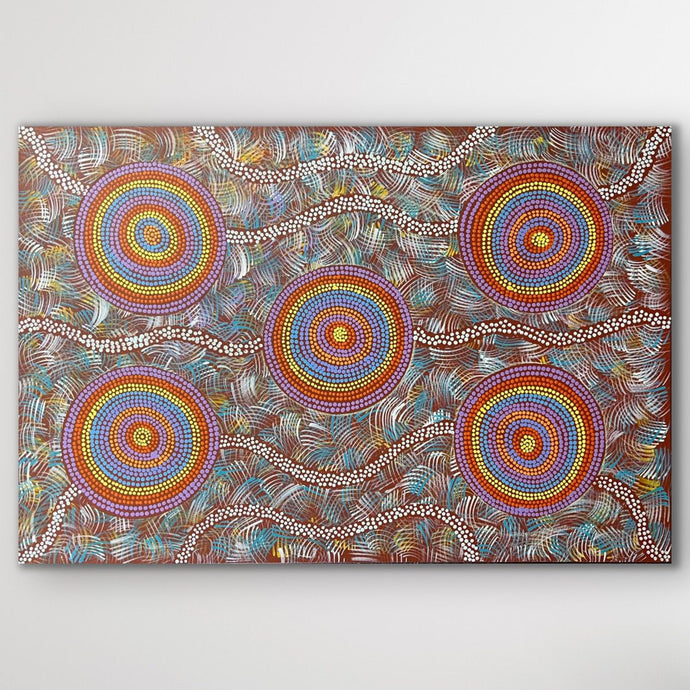 Rectangular painting showing the Budgerigar Dreaming story, featuring radiating circular forms and bright desert tones.