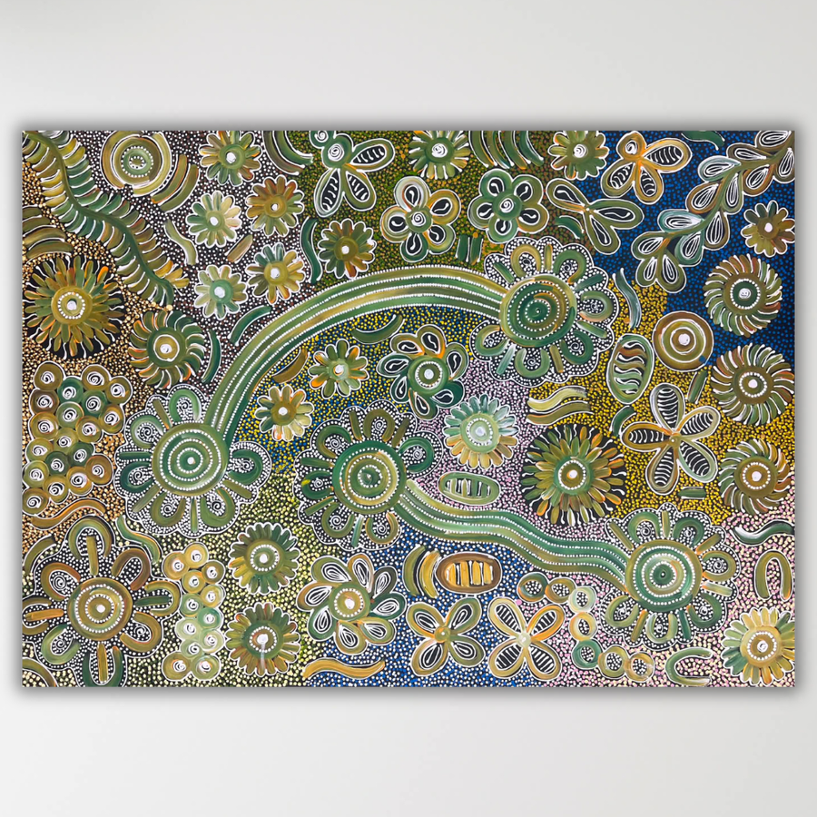 "Bush Flowers" Bernadine Johnson Kemarre 99cm x 72cm painting canvas featuring intricate patterns of green, yellow, blue, and white dots forming floral and curved motifs, displayed on a light gray wall.