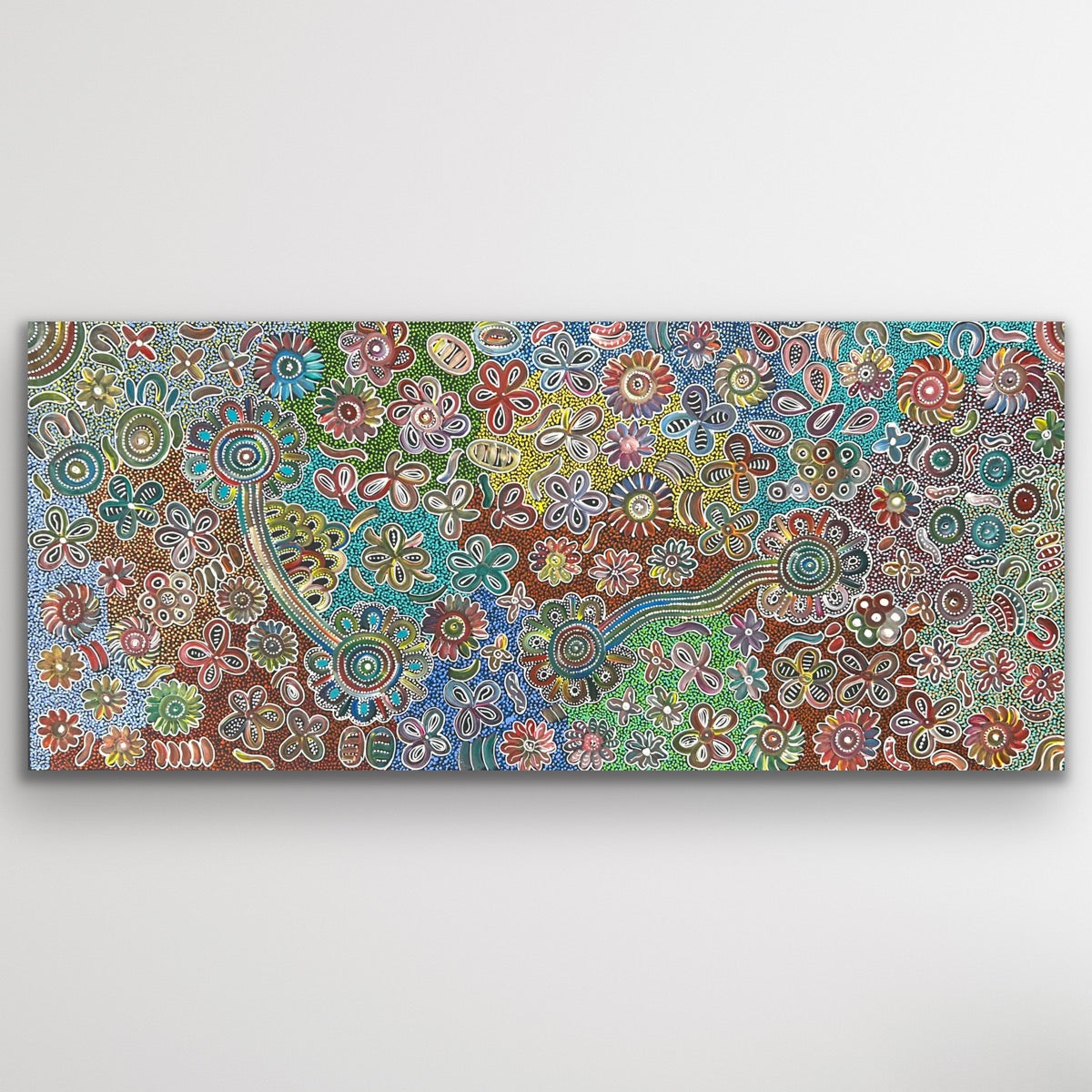 Full view of Bush Flowers showing radiant pinks, greens and ochres arranged in circular floral motifs across the large canvas.