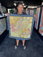 Load image into Gallery viewer, Aboriginal artwork “Bush Flowers” by Bernadine Johnson Kemarre displayed at Art by Farquhar Edwardstown gallery
