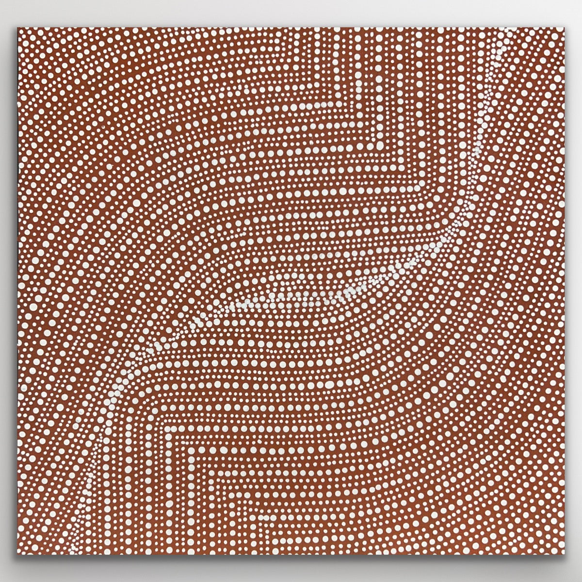 Fine dot patterns symbolise desert pathways and the harvest of bush onions beneath the surface.