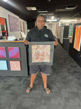Load image into Gallery viewer, ChantelleRobertson holding her painting 

