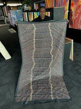 Load image into Gallery viewer, Chantelle Robertson standing with her large Water Dreaming painting at Art by Farquhar Adelaide Aboriginal Art Gallery
