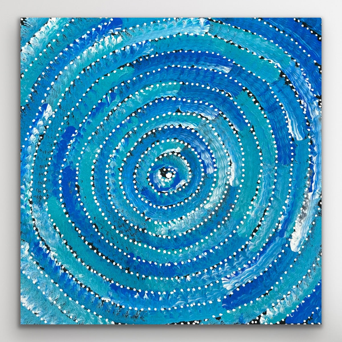 Full view of the artwork’s spiral patterns symbolising movement and continuity.