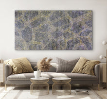 Load image into Gallery viewer, Living room with a large Aboriginal painting on the wall above a sofa.
