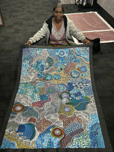 Load image into Gallery viewer, Photo of Janet Golder Kngwarreye’s My Country artwork held at Art by Farquhar to show scale.
