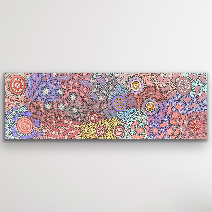 Soft pinks, oranges and blues ripple through fine dotted pathways, evoking harmony and movement across the desert landscape.
