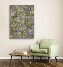 Load image into Gallery viewer, Aboriginal floral painting on a wall above a green armchair and wooden coffee table.
