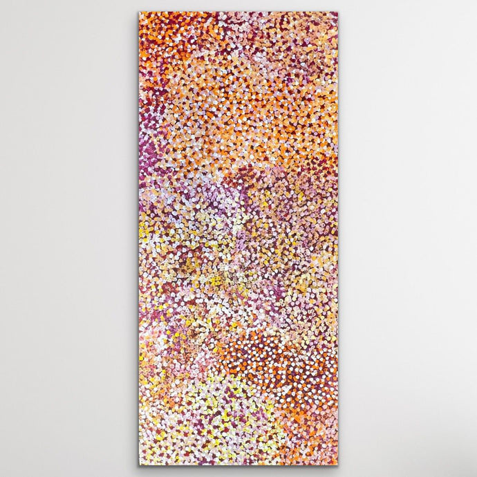 Aboriginal painting Bush Plums Janet Golder Kngwarreye 197cm x 89cm shown on white wall vertical