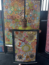 Load image into Gallery viewer, Julieanne Nungurrayi Turner holding Budgerigar Dreaming &amp; Bush Tucker painting
