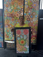 Load image into Gallery viewer, Julieanne Nungurrayi Turner holding her Budgerigar Dreaming Aboriginal artwork
