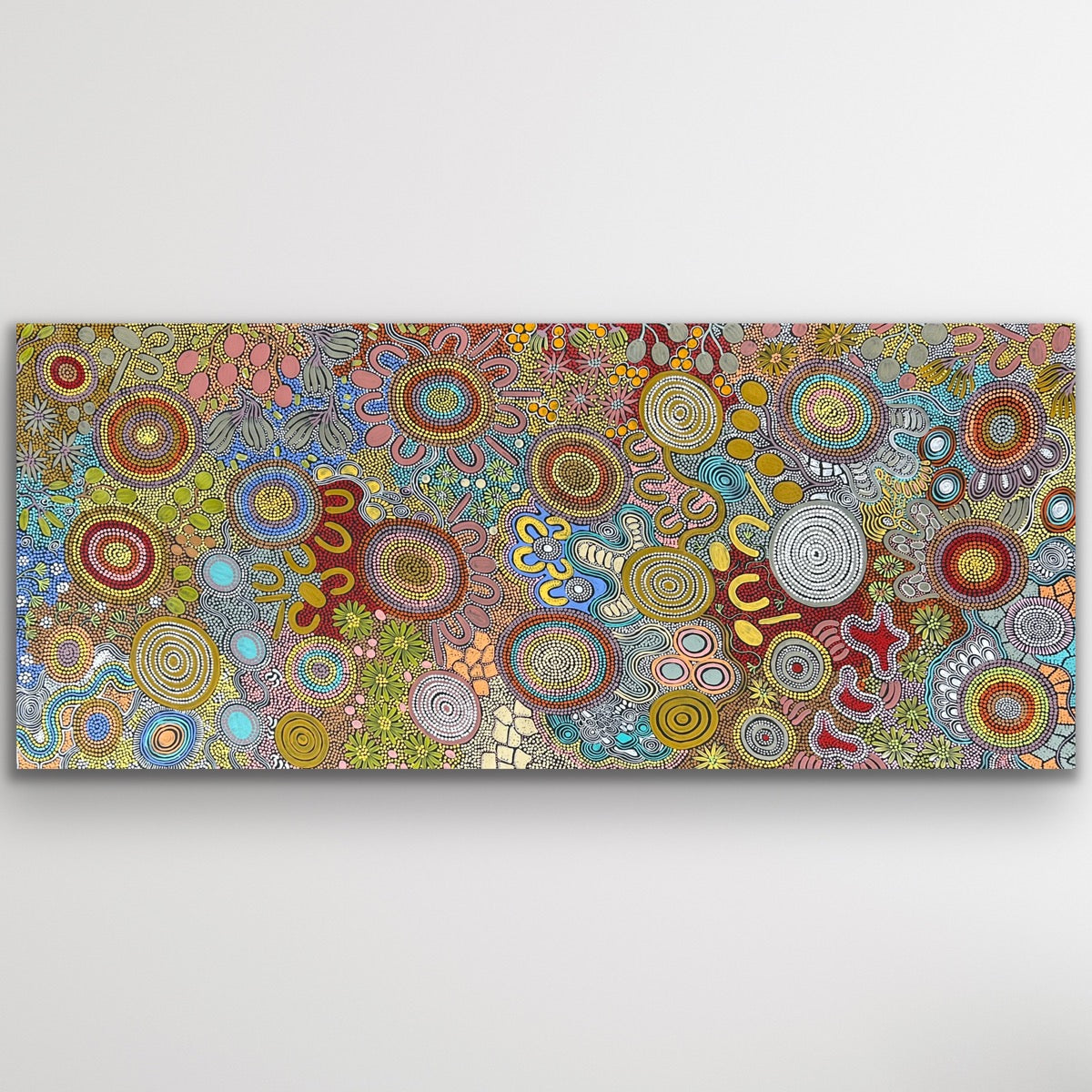 Full image of Women’s Hunting Story by Julieanne Nungurrayi Turner showing earthy ochre tones, circular campsites and women’s tracks.