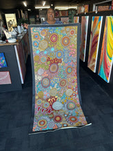 Load image into Gallery viewer, The artist Julieanne Nungurrayi Turner photographed beside her large Women’s Hunting Story painting at Art by Farquhar Aboriginal Art Gallery.
