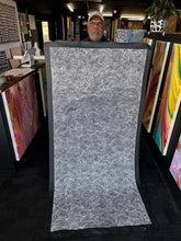Load image into Gallery viewer, Artist Marshall Jangala Robertson holding his Ngapa Jukurrpa Water Dreaming painting
