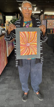 Load image into Gallery viewer, Maureen holding her painting at Art by Farquhar aboriginal art gallery
