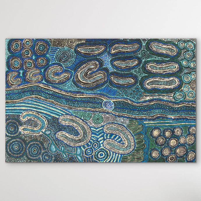 Dream time art piece with blue, green, and cream and patterns on a white wall