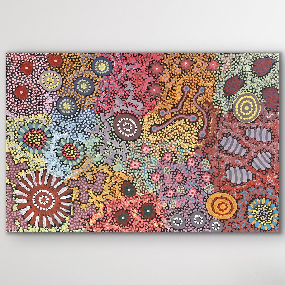 An intricate canvas alive with layered colour and pattern, illustrating Yuelamu Country and its sacred sites.