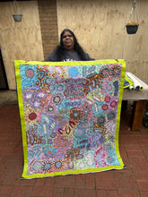 Load image into Gallery viewer, Artist Michelle Possum Nungurrayi holding Grandmother&#39;s Country, emphasising her connection to Clifford Possum’s legacy

