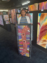 Load image into Gallery viewer, Photo of Minma Malilu held in a gallery space showing scale, colours and detailed pattern work.
