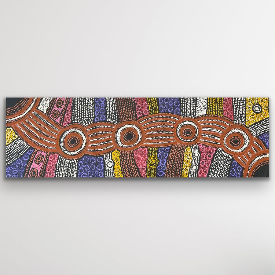 Full view of Clarise Tunkin’s Minma Malilu painting in horizontal format showing detailed circles and dot work.