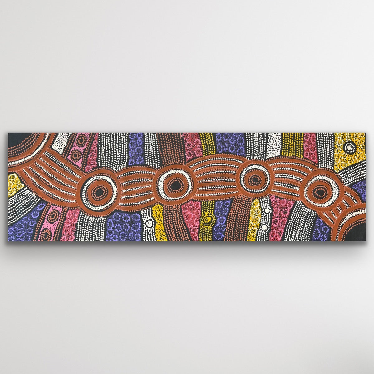 Full view of Clarise Tunkin’s Minma Malilu painting in horizontal format showing detailed circles and dot work.