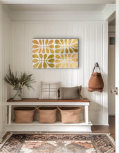 Load image into Gallery viewer, Gold Acacia Leaves Watiya Tjuta artwork by Debra Nangala McDonald displayed above a console in a neutral interior
