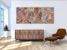 Load image into Gallery viewer, My Country (Utopia) Janet Golder Kngwarreye 201cm x 87cm painting on a white wall above a wooden cabinet in a modern room.
