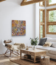 Load image into Gallery viewer, Living room with a colorful &quot;My Country (Utopia)&quot; Janet Golder Kngwarreye 94cm x 91cm Utopia Aboriginal Artwork painting on the wall, a couch, and a coffee table.
