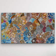 Load image into Gallery viewer, Large Aboriginal painting &quot;My Country Utopia&quot; by Janet Golder Kngwarreye displayed against a white wall.
