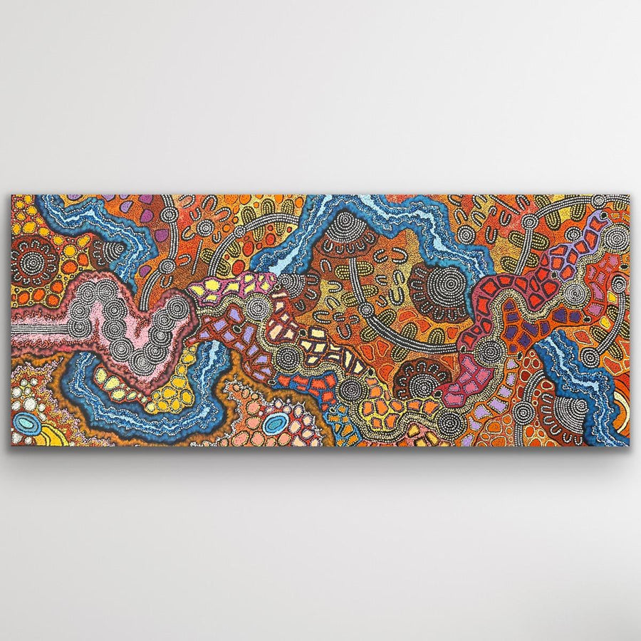 Large panoramic My Country painting showing winding waterways, dotted pathways and rich desert colours.