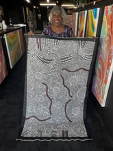 Load image into Gallery viewer, Artist Nancy Martin Napangarti holding Bush Onion painting featuring intricate design and natural desert palette

