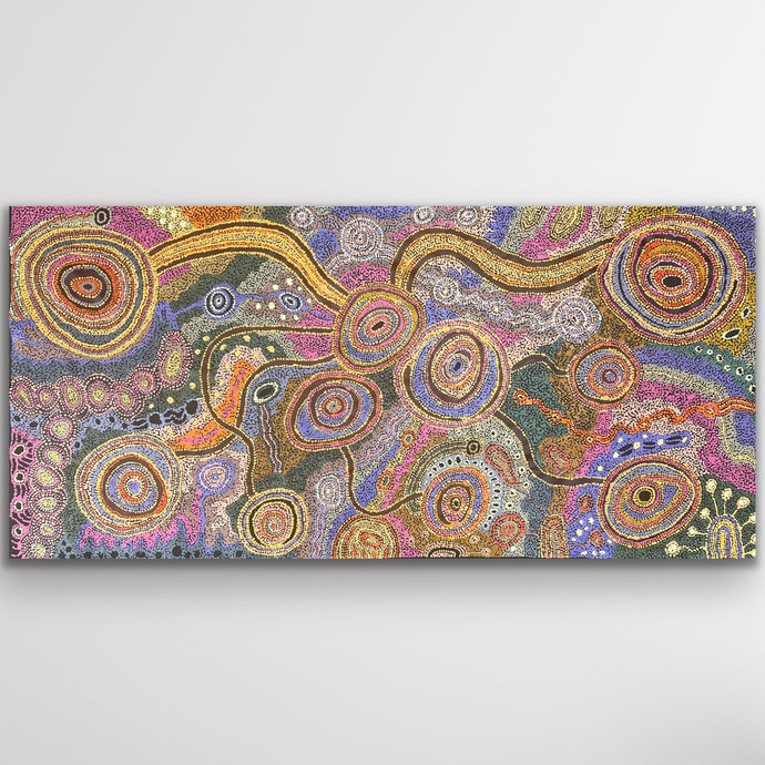 Large Aboriginal artwork with colourful circular forms and pathways representing Country
