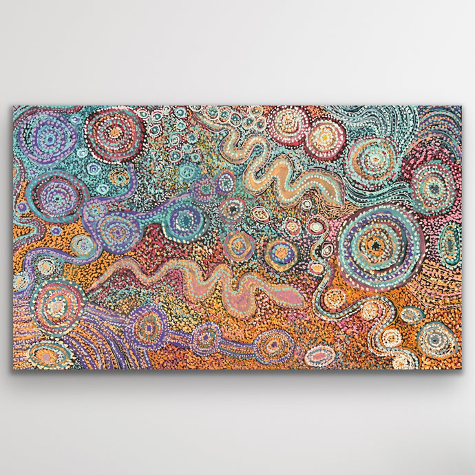 Original Aboriginal painting “Piltati Tjukurpa” by Rhoda Tjitayi with circular desert motifs and warm orange tones