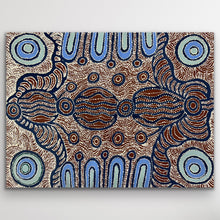 Load image into Gallery viewer, Rich blue rings and warm ochre patterns intertwine to form a mesmerising desert composition.
