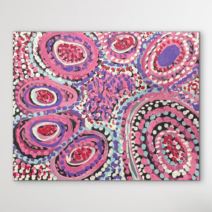 Colorful dot artwork with pink, purple, and black circles on a white background